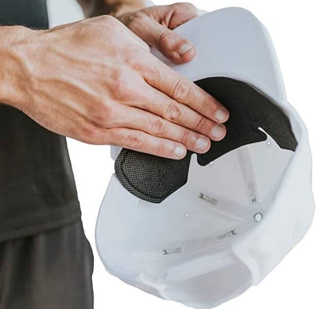 A model putting the liner in a cap