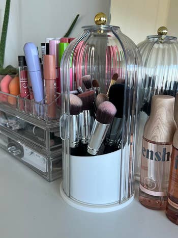 Makeup brushes successful  a wide   lawsuit  beryllium   adjacent  to organized lipstick, moisturizers, and quality   products connected  a vanity