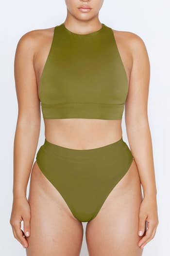 model wearing the same swimsuit in moss color