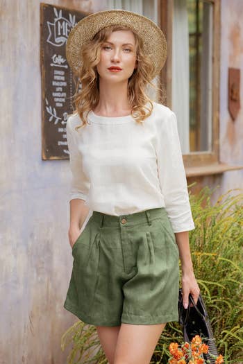 Model wearing the green shorts