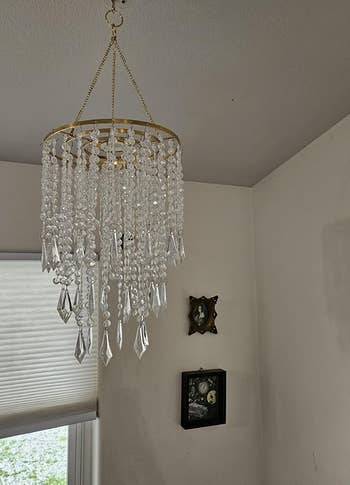 chandelier with crystal beads hanging in a room,