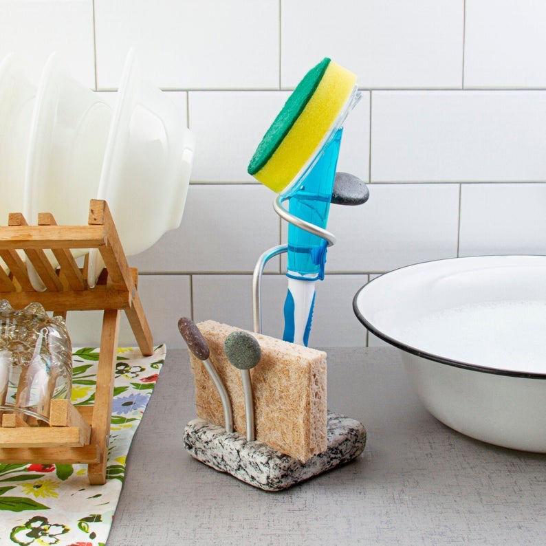 granite base holder holding sponge and supporting large dish brush vertically with aluminum arms
