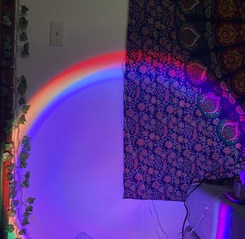 the rainbow circle light on a wall 