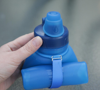 a reviewer's blue water bottle completely collapsed