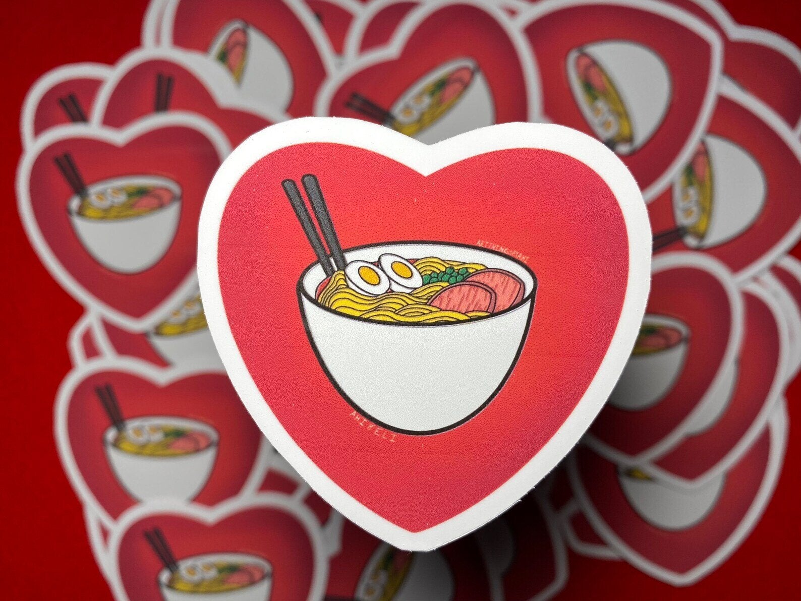 Red heart sticker with bowl of ramen in the middle