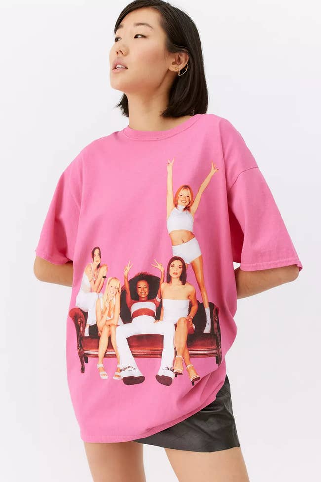 model wearing pink tee shirt with the Spice Girls on it