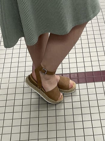 a reviewer wearing tan espadrilles