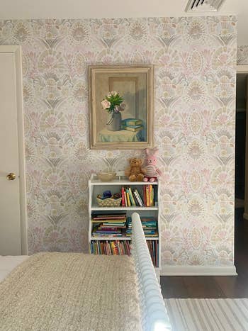 a different reviewer's room with  light pink damask wallpaper