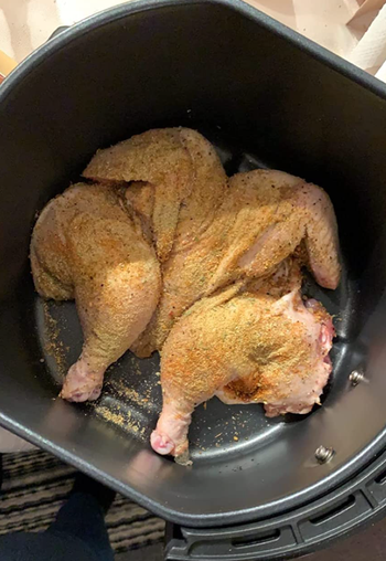 A reviewer's seasoned chicken in an airfryer 