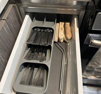 reviewer image of utensils stacked in the holder in a drawer