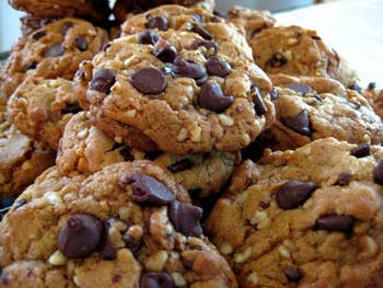 A close-up of a pile of chocolate chip cookies, suggesting a theme for a shopping article on baked goods or kitchenware