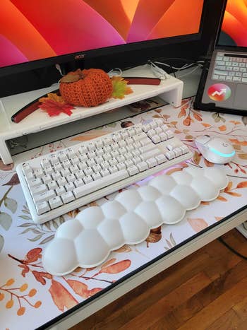 the cloud wrist rest next to a keyboard