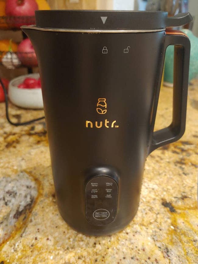 a reviewer photo of the nut milk machine in black 