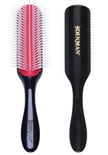the pink and black detangling brush with sculpted bristles