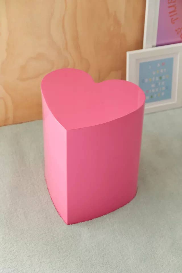 pink heart-shaped side table in a room