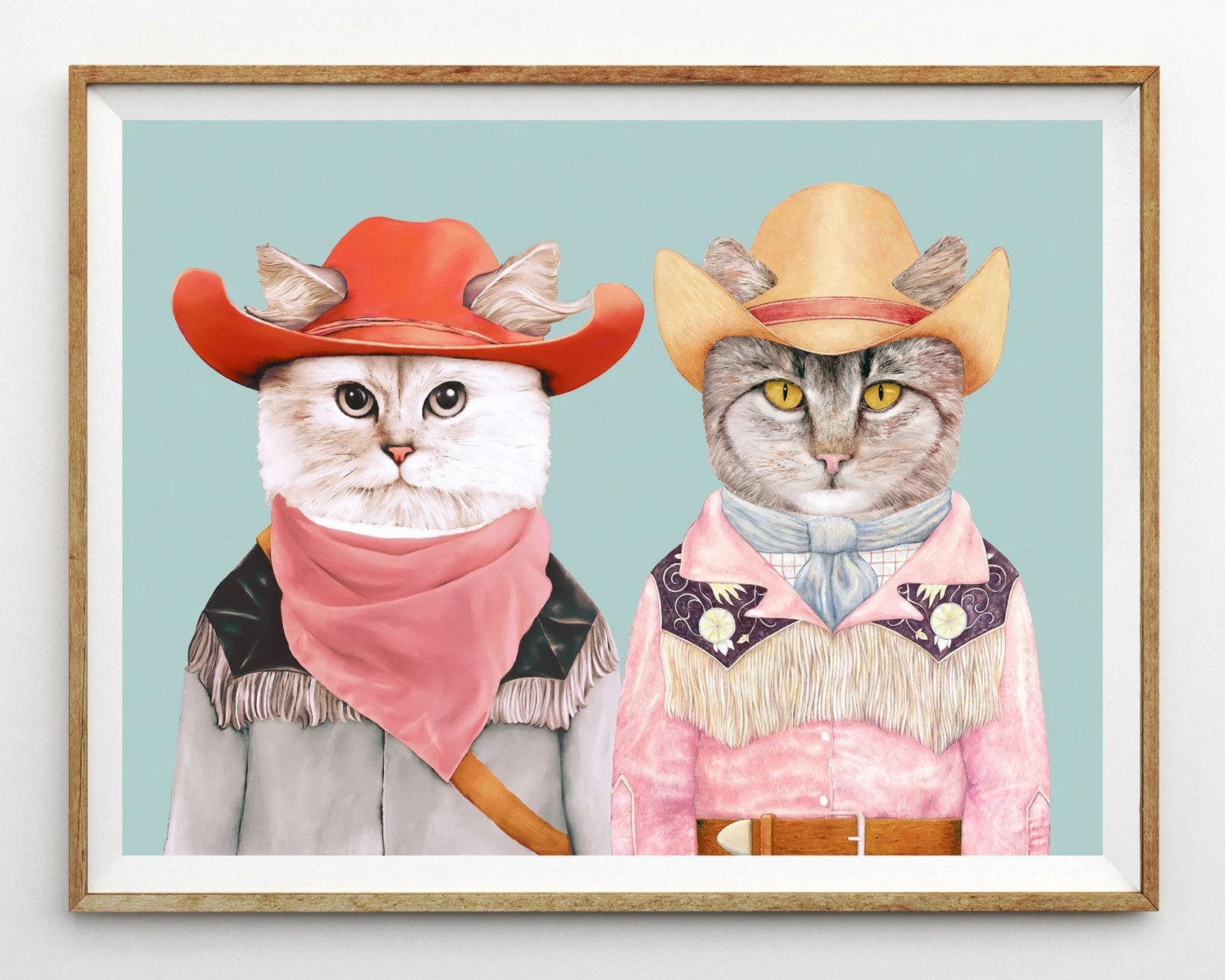 print of two cats wearing cowboy outfits 