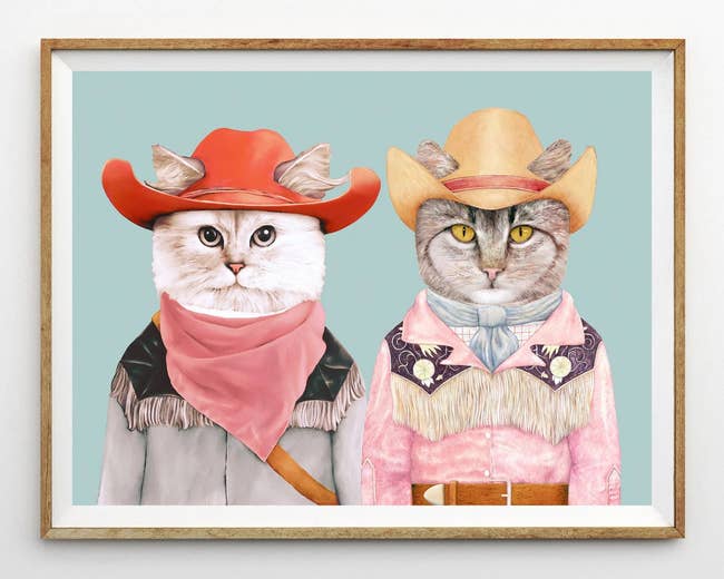 print of two cats wearing cowboy outfits 