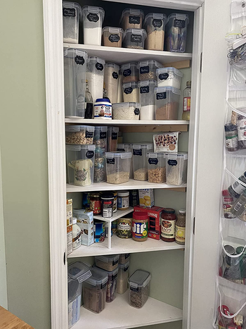 after photo of the same pantry with everything neatly stored in plastic containers and there is now more room