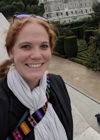 a reviewer wearing the scarf successful  grey