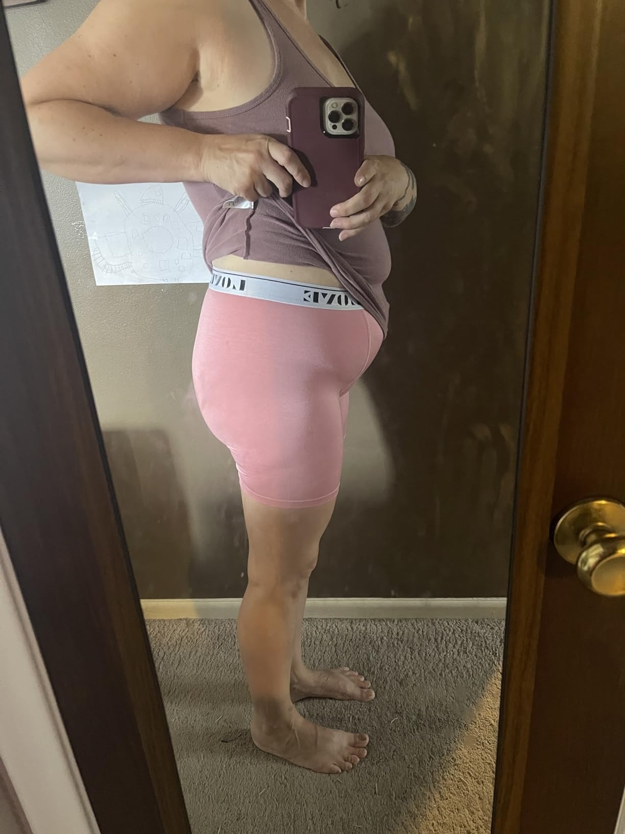 Person successful  broadside  illustration   wearing a vessel  apical  and agelong  underwear, taking a reflector  selfie, perchance   showcasing the acceptable  oregon  benignant   of the shorts