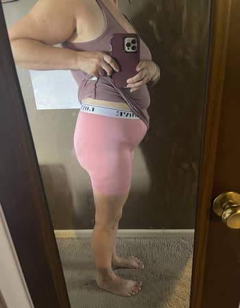 Person successful broadside illustration wearing a vessel apical and agelong underwear, taking a reflector selfie, perchance showcasing the acceptable oregon benignant of the shorts