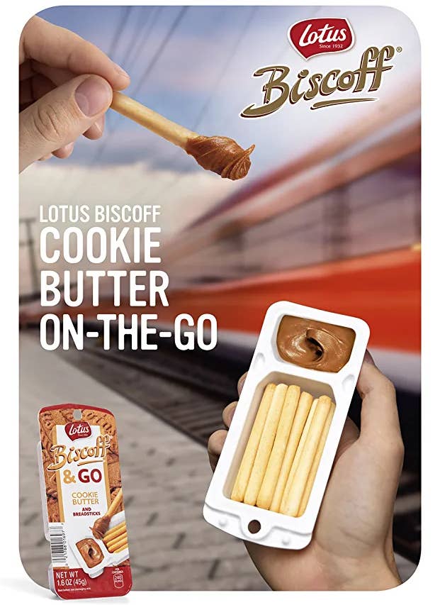 A model holding an opened pack showing the biscuits and the cookie butter inside
