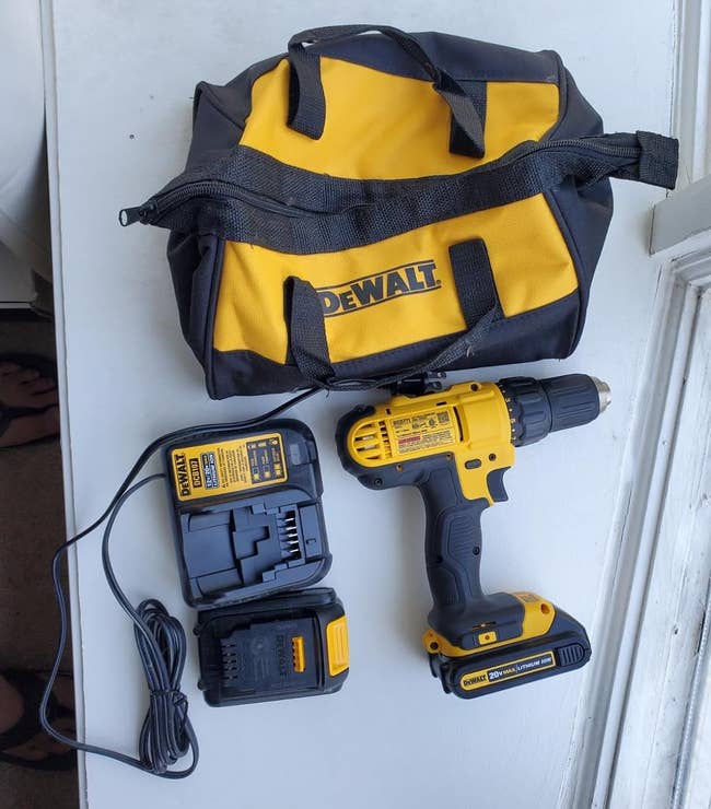 reviewers yellow and black drill with the charger and the bag it stores in