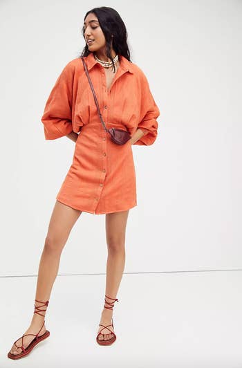 model wearing orange dress
