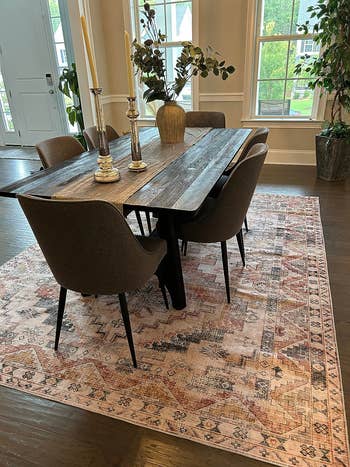 Wooden eating  array  with modern   chairs connected  an ornate rug, acceptable   successful  a country   with decor plants. Ideal for location  furnishing inspiration