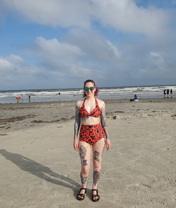 reviewer wearing the high-waisted two piece in red and black