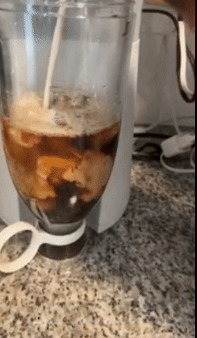 Reviewer blending ice and coffee in the blender 