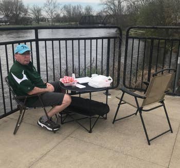 Reviewer using the black picnic table