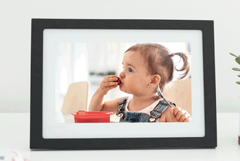 The displaying a photo of a child on its screen