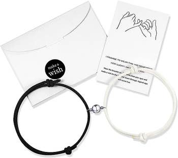 two bracelets with envelope and note