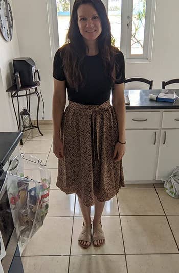 Reviewer wearing black and brown dress