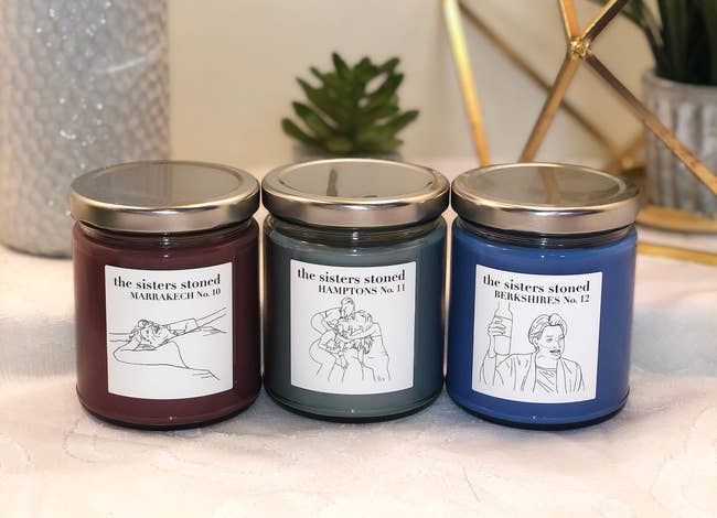 three different real housewives of new york themed candles