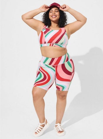 model in red green and pink swirl print set