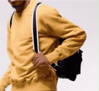 a gif of a model folding up the backpack 