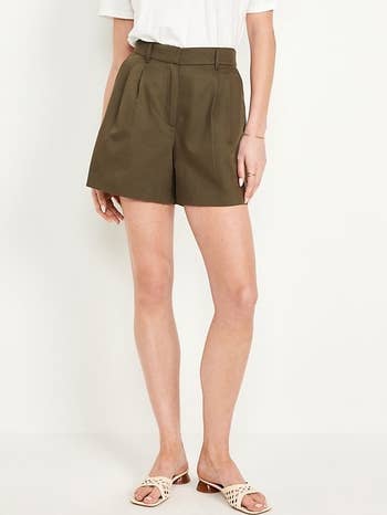 model wearing shorts in olive