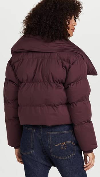 the same model showing the back of the puffer jacket