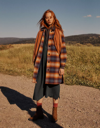 A model wearing the ombré plaid coat