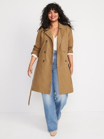 model wearing the tan trench coat