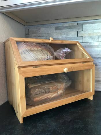 reviewer photo of wooden bread box in corner of kitchen counter