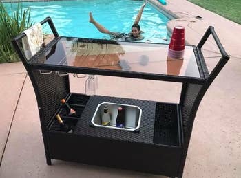 Reviewer image of the outdoor bar cart next to a pool