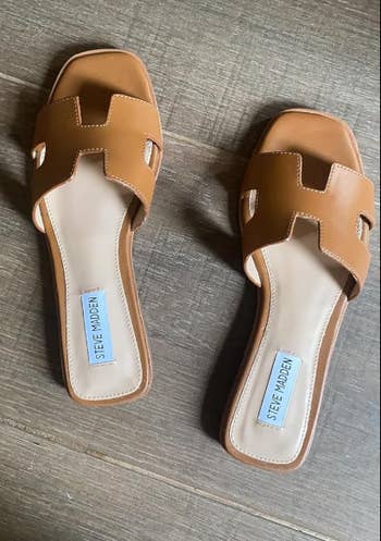 reviewer's tan slip-on sandals with cut-out design
