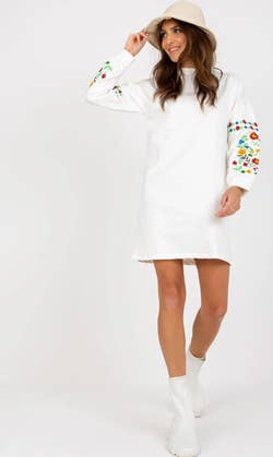 The model wearing the dress in white