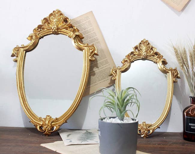 two gold mirrors