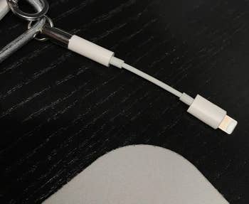 A reviewer's close-up of the dongle holder and a secured dongle