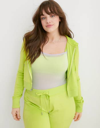 a model in a lime green velour set
