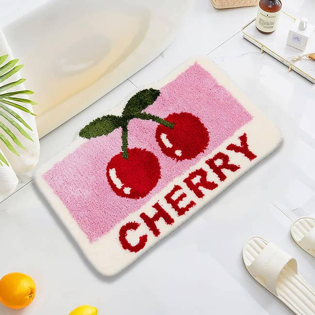 A cherry bath mat